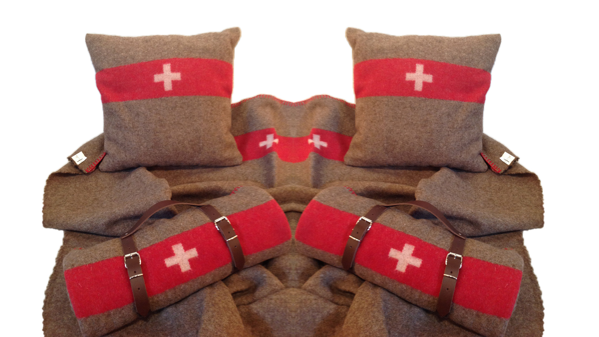 Schweizer Militärdecken und Kissen als Wohnaccessoires und Werbegeschenke